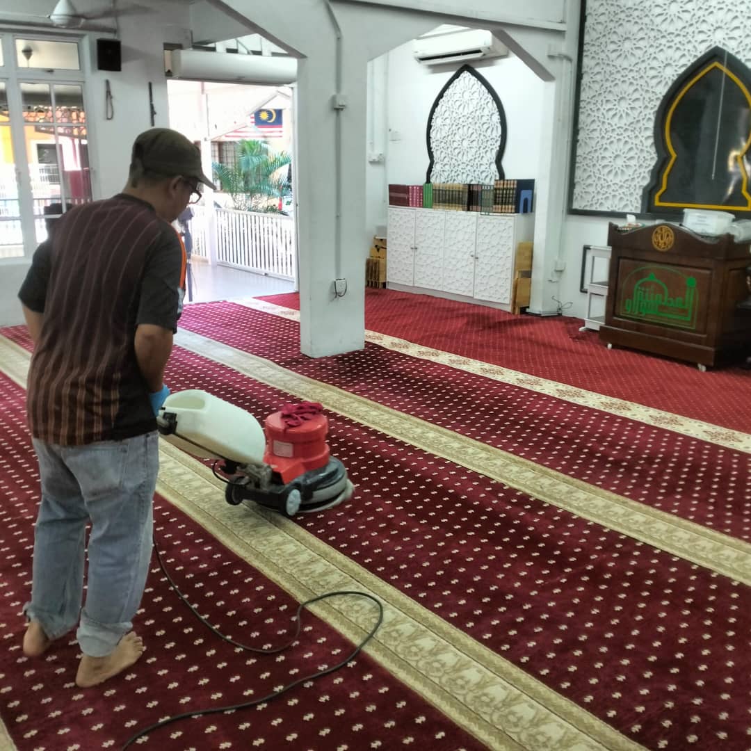 Carpet polishing in a mosque prayer hall